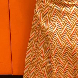 Skirt and crop top with a orange scarf